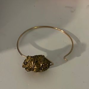 gold bracelet with false gold rock.